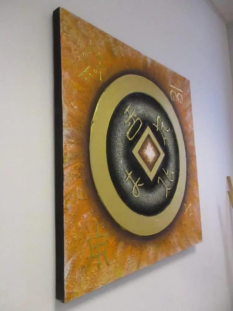 Quadro Batik Artigianale in Rilievo – Simboli Dorati e Sfumature Arancio (83x53 cm)
